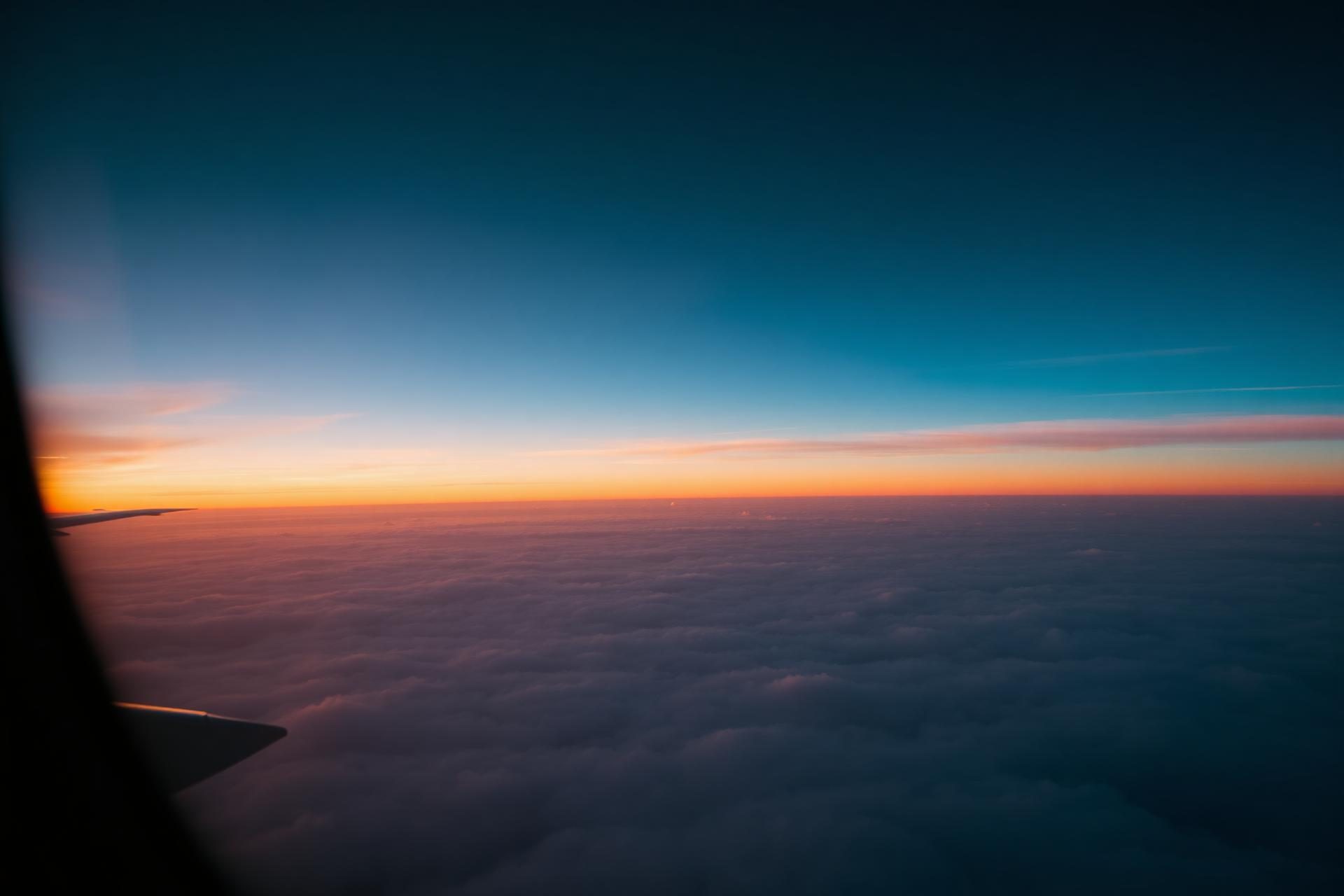 Window seat view of cloud sea at sunset